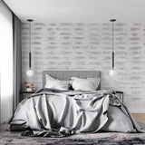 Grey brick wall mural creating depth in a modern home office space