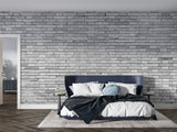 Modern grey brick wallpaper in urban loft bedroom setting
