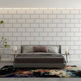 Modern white brick wallpaper in a bright minimalist living room showing clean lines and urban style