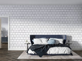 Home office space with modern white brick wall mural creating professional backdrop