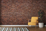 Rustic brick mural in cozy dining room with wooden table and pendant lights