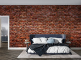 Brick effect feature wall in home office with modern furniture and natural light