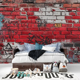 Urban brick wall design with graffiti elements in contemporary loft space