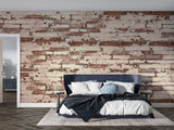 Industrial brick mural wallpaper in cozy bedroom with metal fixtures
