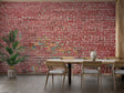Red brick wallpaper in modern living room with leather sofa and industrial lighting