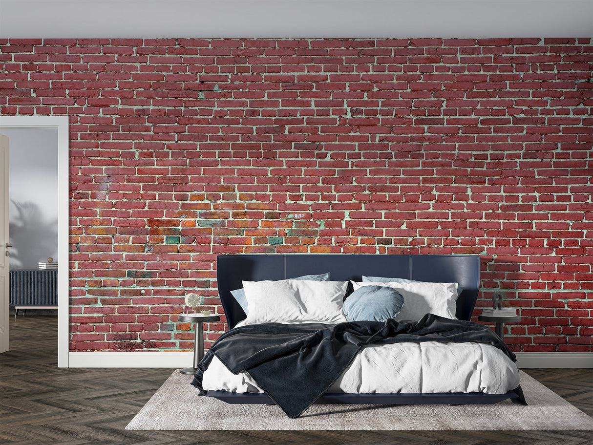 Red brick mural wallpaper in home office with metal desk and exposed beams
