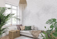 White brick texture wallpaper in modern living room with grey sofa and natural light