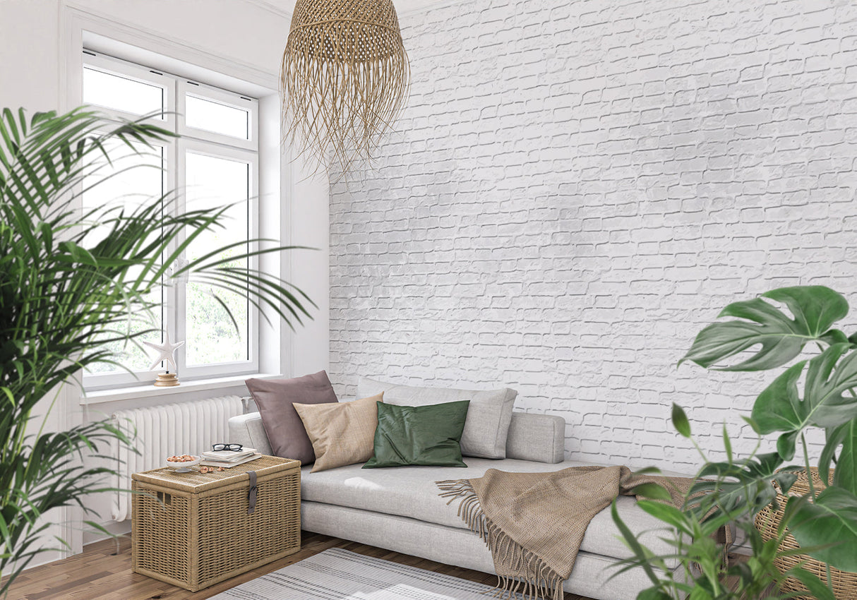 White brick texture wallpaper in modern living room with grey sofa and natural light