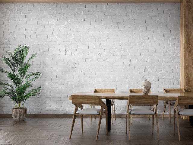 White brick mural wallpaper in modern living room, adding texture and brightness to seating area