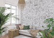 White brick wall mural in modern minimalist living room showing clean industrial design