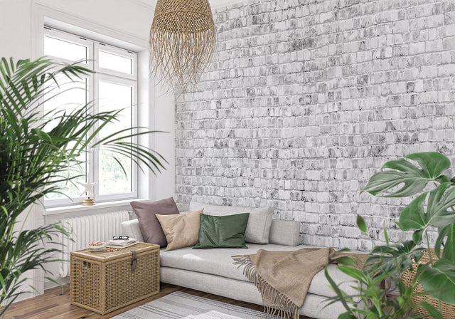White brick wall mural in modern minimalist living room showing clean industrial design