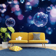 Bubble galaxy wallpaper creating a dreamy atmosphere in a modern living room with floating pink and blue spheres