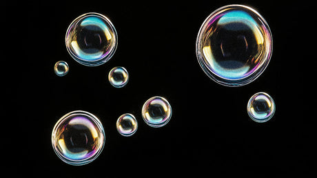 Iridescent bubble wallpaper design file showing floating spheres pattern on black background