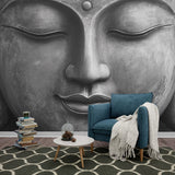 Buddha wall mural creating a peaceful meditation corner in a modern living room with minimal furniture and natural light