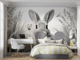 Monochrome rabbit wallpaper creating calm atmosphere in baby room