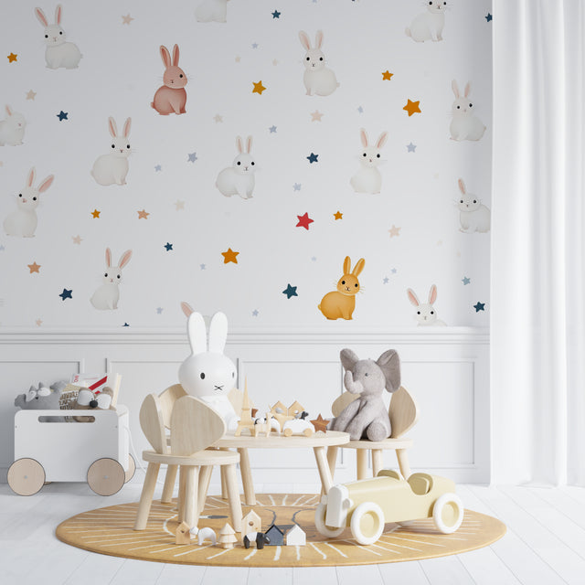 Bunny wallpaper creating a magical atmosphere in a modern nursery with soft lighting and star accents