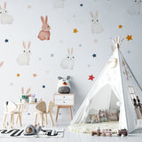 Baby room with bunny nursery wallpaper featuring playful rabbit design and twinkling stars