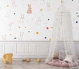 Kids bedroom showcasing bunny wallpaper with dreamy star pattern and soft color palette