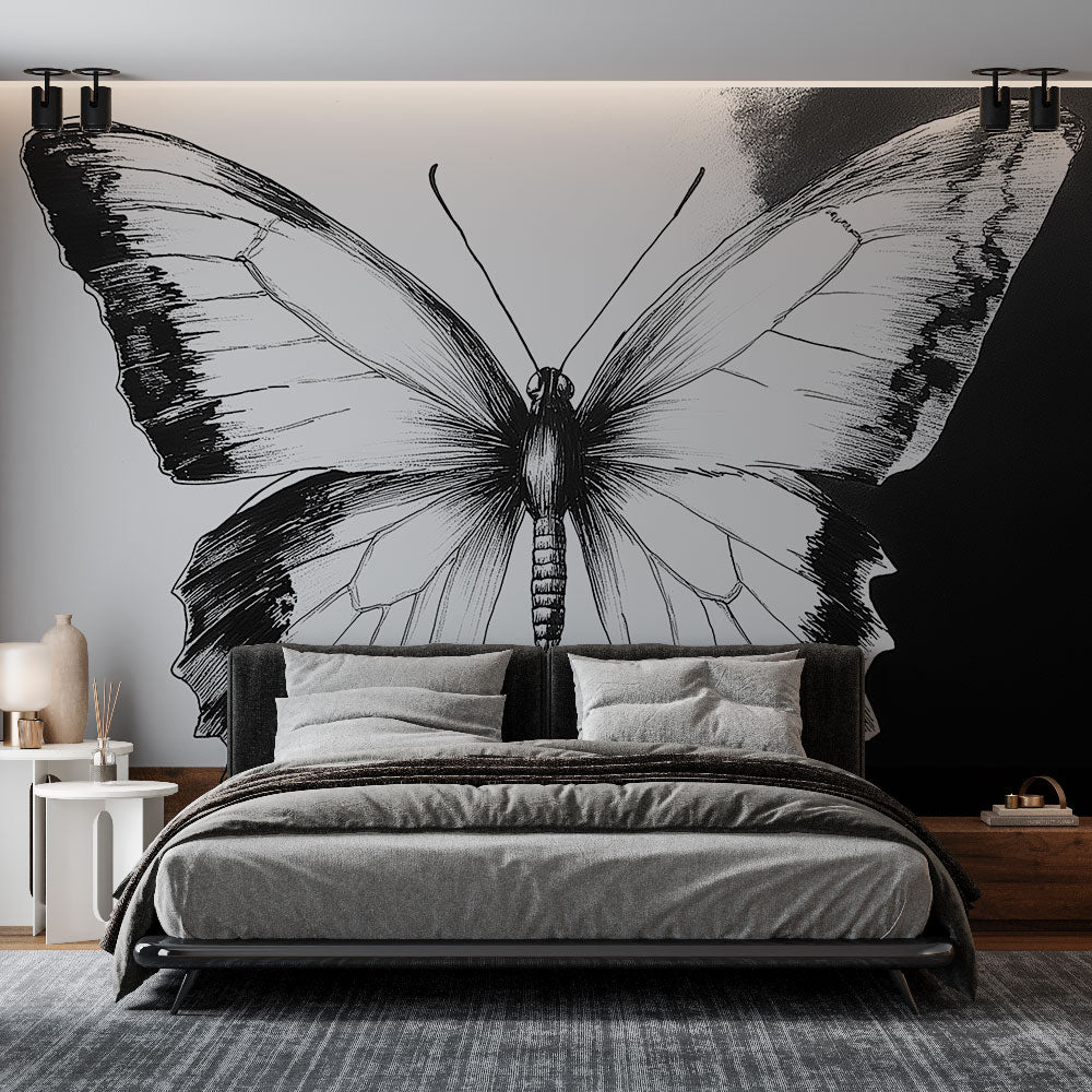 Black and white butterfly wall mural creating dramatic impact in a modern living room with minimalist furniture