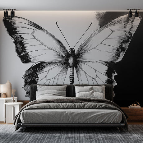 Black and white butterfly wall mural creating dramatic impact in a modern living room with minimalist furniture