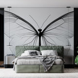 Black and white butterfly wall mural creating an elegant focal point in a bright, modern living room setting