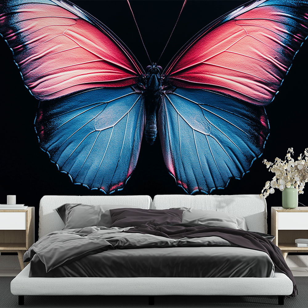 Butterfly wall mural with blue and pink wings creating drama in a modern living room with grey sofa and natural light