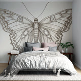 Black and white butterfly line art wallpaper creating an elegant statement wall in a modern living room setting