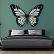 Black and white butterfly wall mural creating modern contrast in a bright living room with minimal furniture