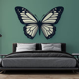 Black and white butterfly wall mural creating modern contrast in a bright living room with minimal furniture