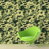 Army camouflage wallpaper creating a bold accent wall in a modern home office