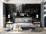 Black and white automotive wallpaper making statement in game room with leather seating