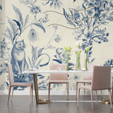 Blue botanical wallpaper with cat motif in home office setting, highlighting delicate design