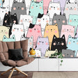 Cute Cat Pattern Wallpaper in a bright nursery with white furniture and soft toys