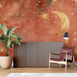 Celestial wallpaper mural in cozy bedroom with soft lighting highlighting golden moons and stars