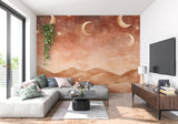 Moon and stars mural bringing magic to a reading nook with plush seating
