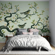 Cherry blossom wallpaper with birds bringing spring charm to a bright living room with green accents