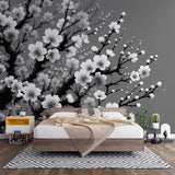 Black and white Cherry Blossom wallpaper creating a striking focal point in a modern Japanese-inspired living room
