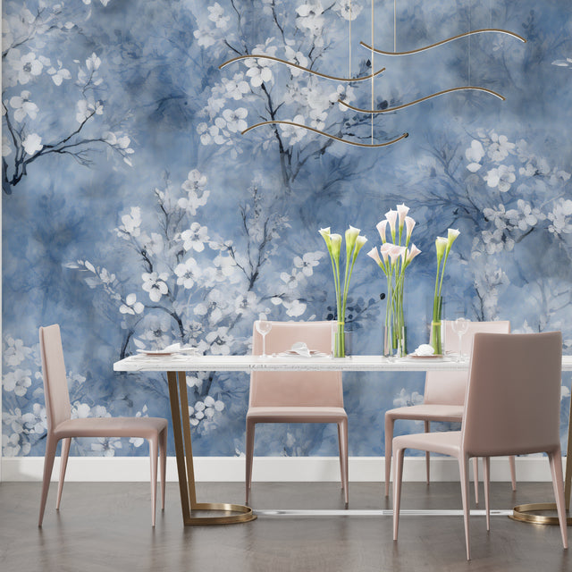 Cherry blossom wallpaper in modern living room showing blue floral pattern against white furniture
