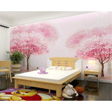 Pink cherry blossom wallpaper brightening up a cozy bedroom with natural light