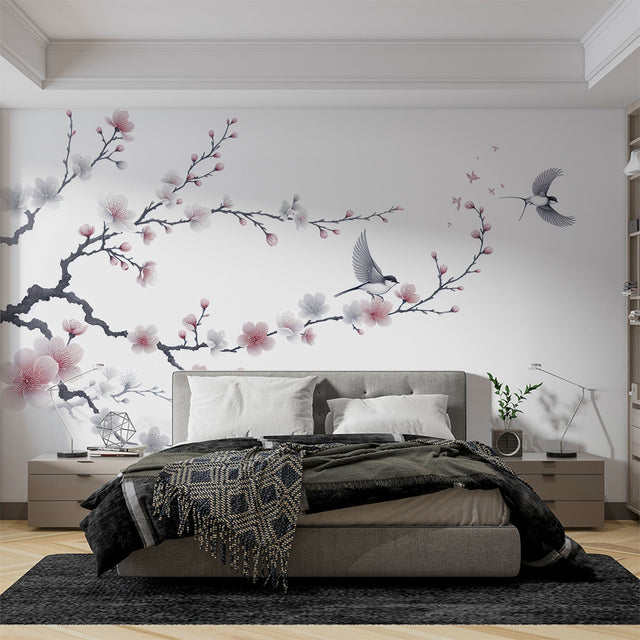 Cherry blossom wallpaper with birds in a bright modern bedroom, pink petals float across white walls creating a peaceful atmosphere