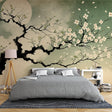 Japanese cherry blossom wallpaper creating a peaceful atmosphere in a modern minimalist bedroom with soft lighting
