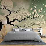 Japanese cherry blossom wallpaper creating a peaceful atmosphere in a modern minimalist bedroom with soft lighting