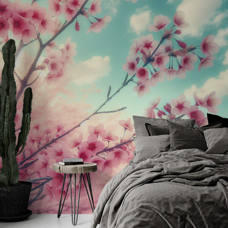 Cherry blossom wallpaper creating a serene atmosphere in a modern bedroom, pink sakura branches against turquoise sky