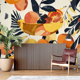 Orange and navy fruit wall mural creating a striking backdrop in a modern kitchen space