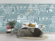 Blue architectural line art wallpaper in a bright modern living room with minimalist furniture