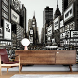 Manhattan comic style wallpaper creating depth in a modern home office, black and white urban design with yellow accents
