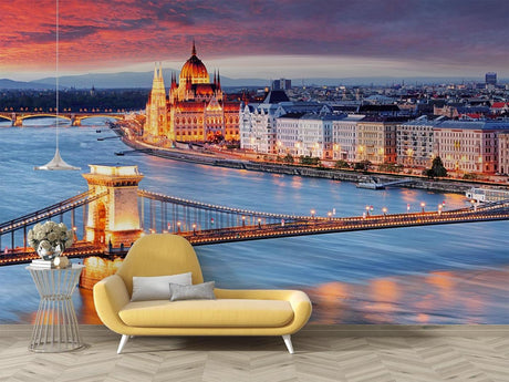 Budapest cityscape mural wallpaper in modern living room, showing warm sunset colors over the Danube