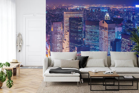 Manhattan skyline wallpaper creating depth in modern living room with grey sofa and minimal decor