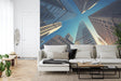 Modern skyscraper wallpaper shown in minimalist home office with white desk and black chair