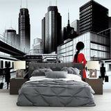 Modern City Wallpaper with red accent displayed in a minimalist living room, creating depth and urban sophistication